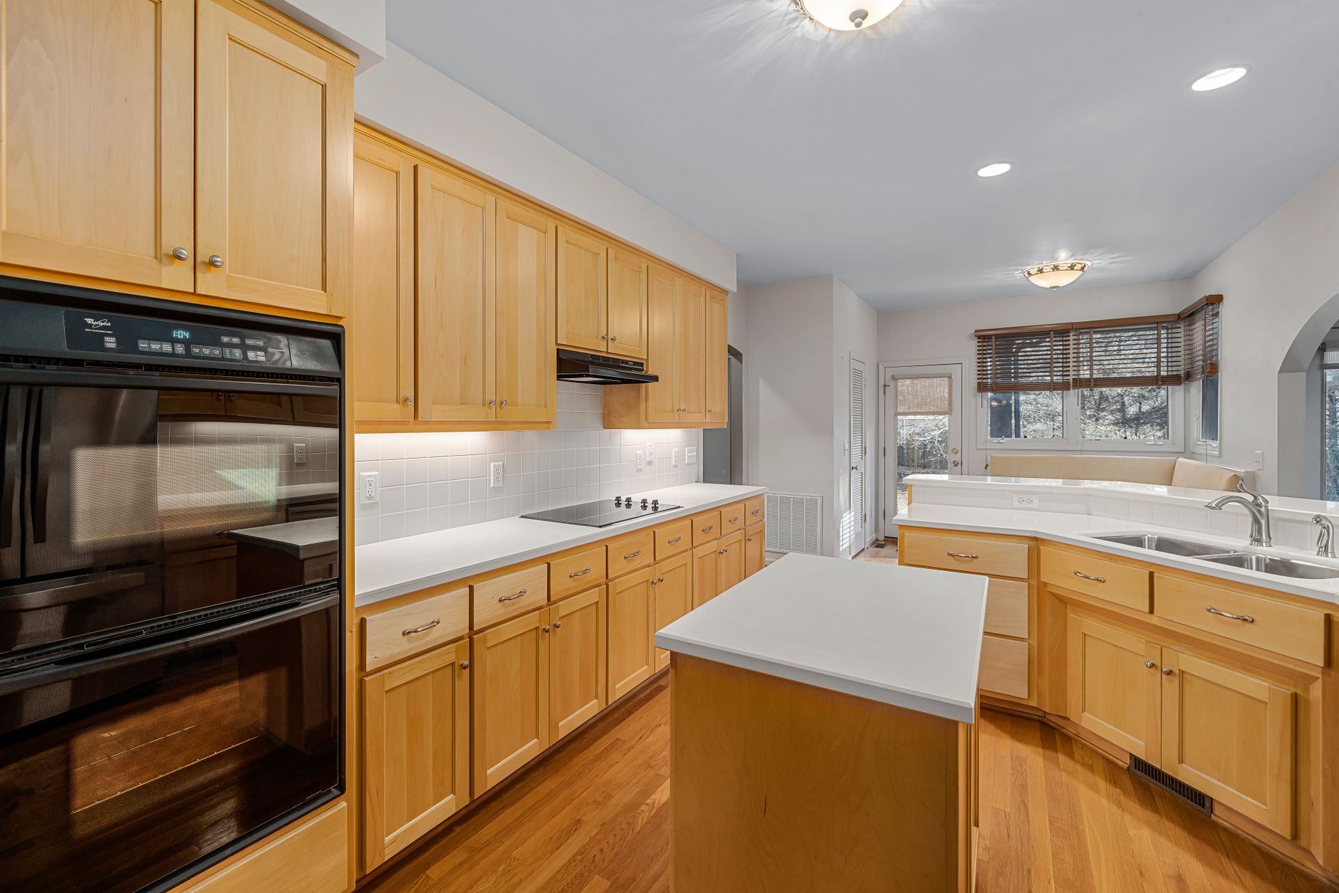 Spacious modern kitchen featuring wooden cabinets, kitchen island, and built-in appliances in Yakima, WA
